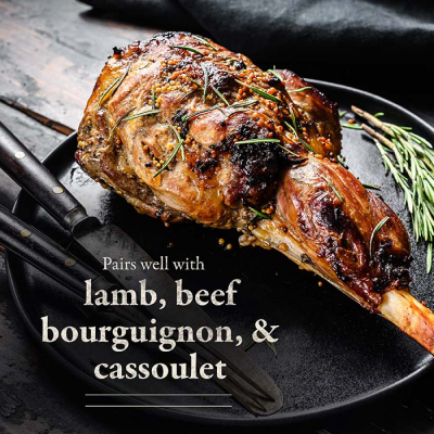 Roasted leg of lamb garnished with rosemary on a Chateau Ste Michelle plate.