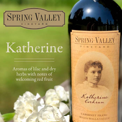 A bottle of Chateau Ste Michelle spring valley vineyard Katherine cabernet franc wine with a label featuring a vintage portrait, set against a background of flowers and greenery.